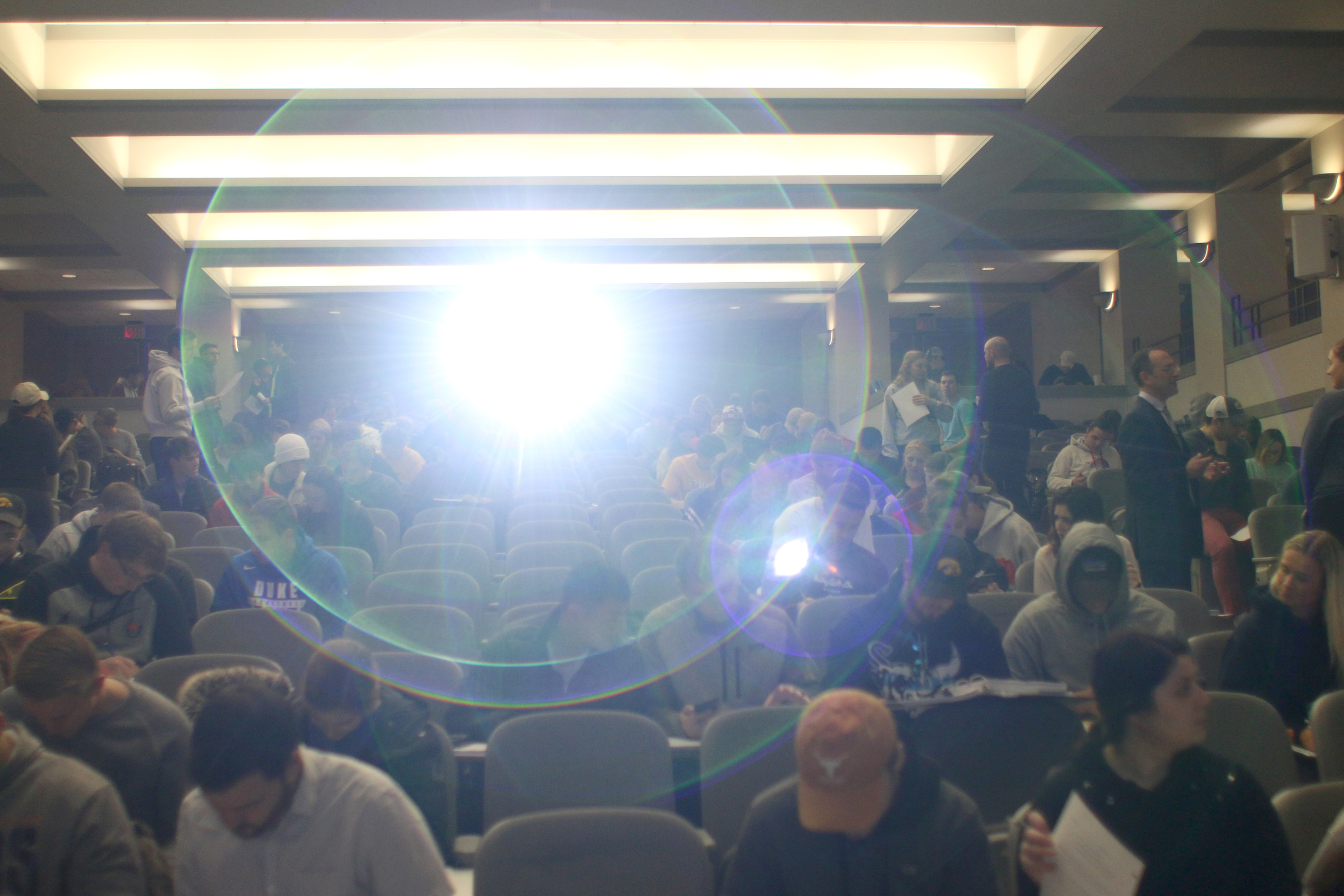 Garfinkel talking to students in a large classroom. 