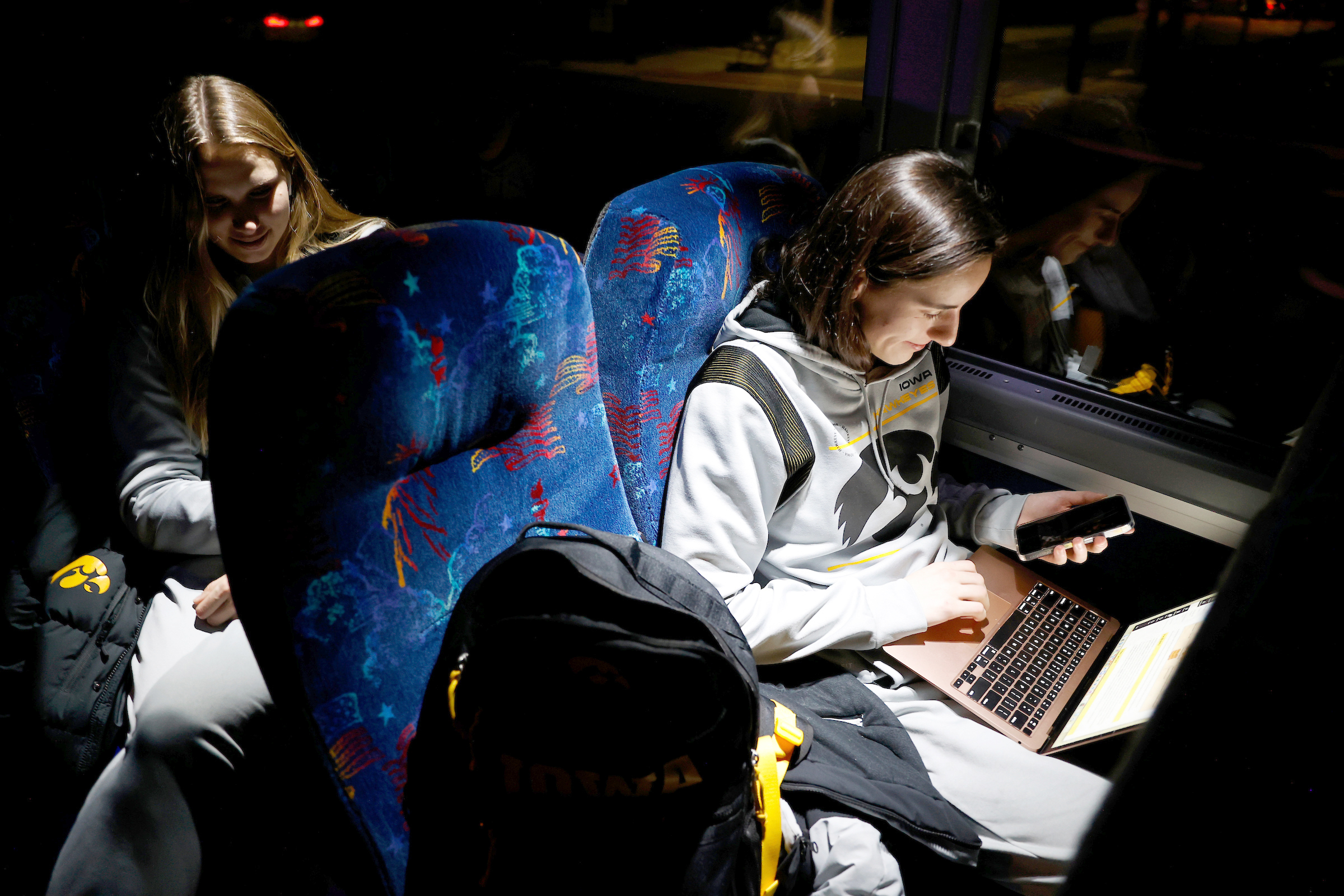 Clark studying on the team bus.
