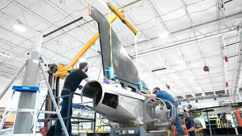 Booom Supersonic aircraft being assembled in a hangar.