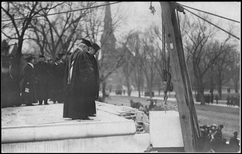 University officers in full regalia watch as the cornerstone is placed on the Gilmore Hall site in 1910. 