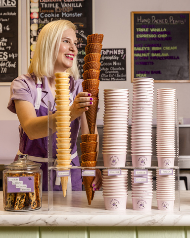 Elisha Smiley with waffle cones at her gelato shop.