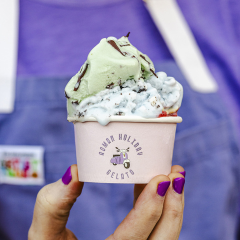 Elisha Smiley holding a cup of gelato.