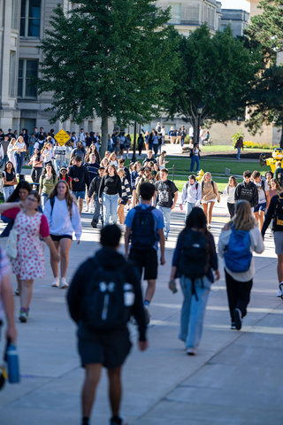 Lots of students walking on crowded sidewalks on the University of Iowa campus Fall 2025.
