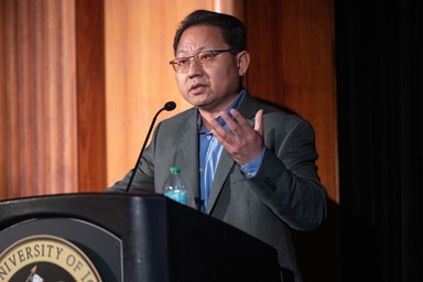 Patrick Fan speaks at a lectern