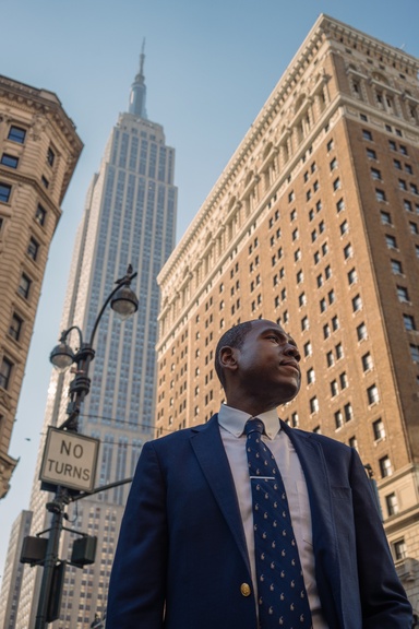 Romelle Morris standing with Empire State building