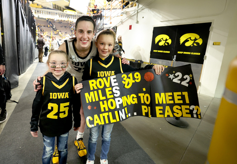 Caitlin Clark with young fans.