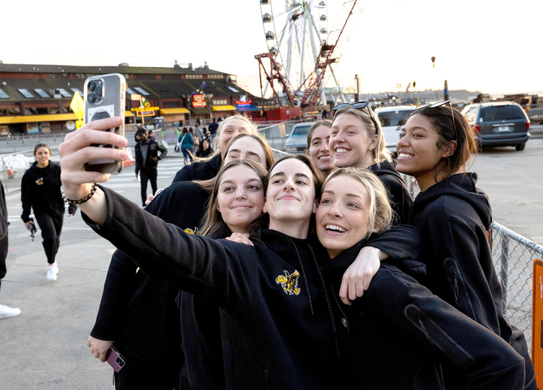Clark taking a selfie with teammates in Seattle, March 2023.