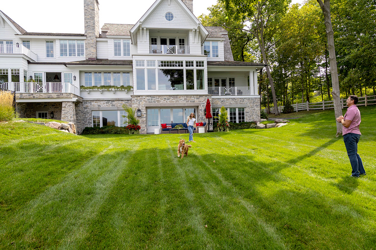 The Greenways playing catch on their lawn in Minnesota. 