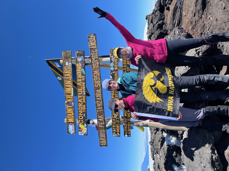 Renea Rathmacher at the top of Mt Kilimanjaro