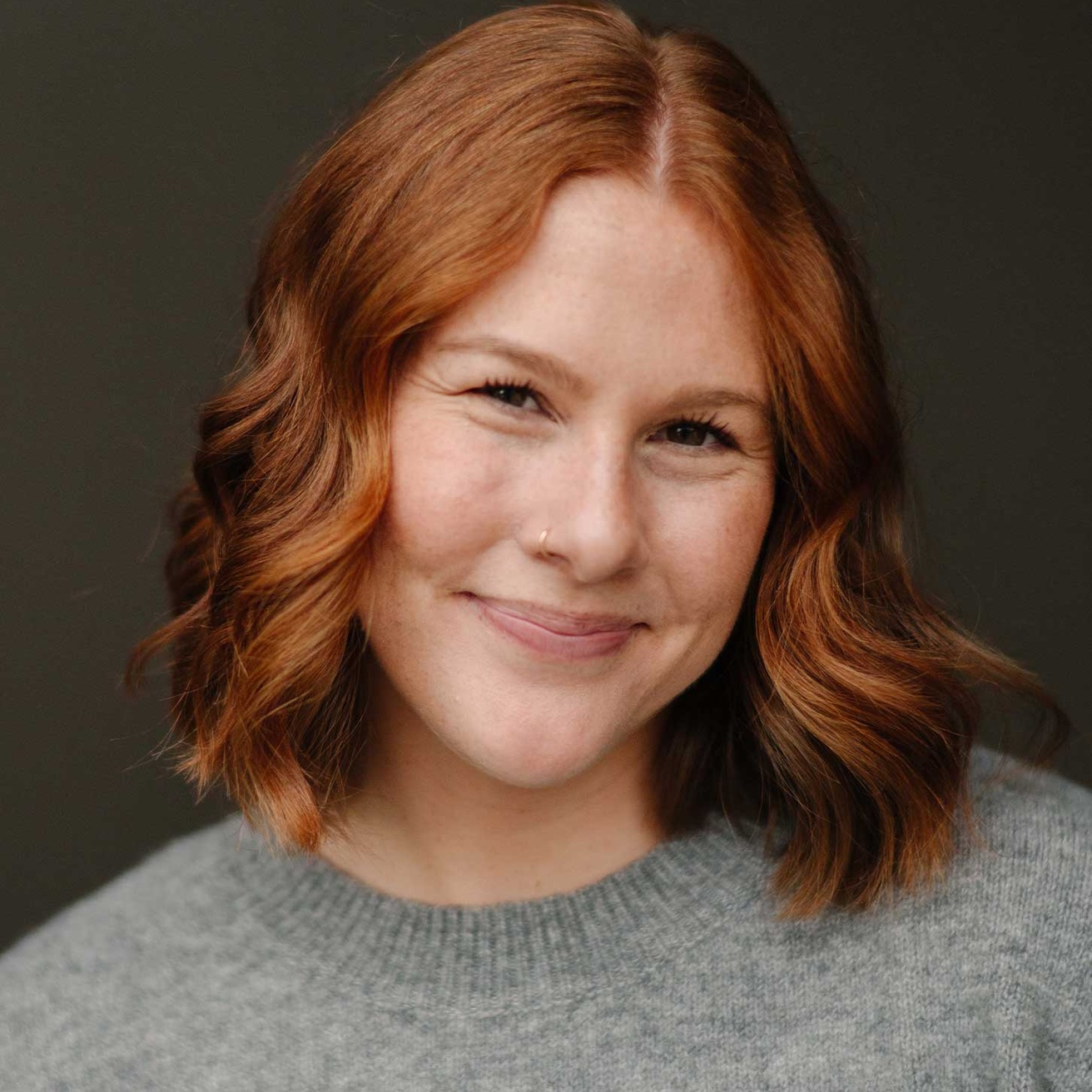 Headshot of Ava Graf looking at the camera and smiling