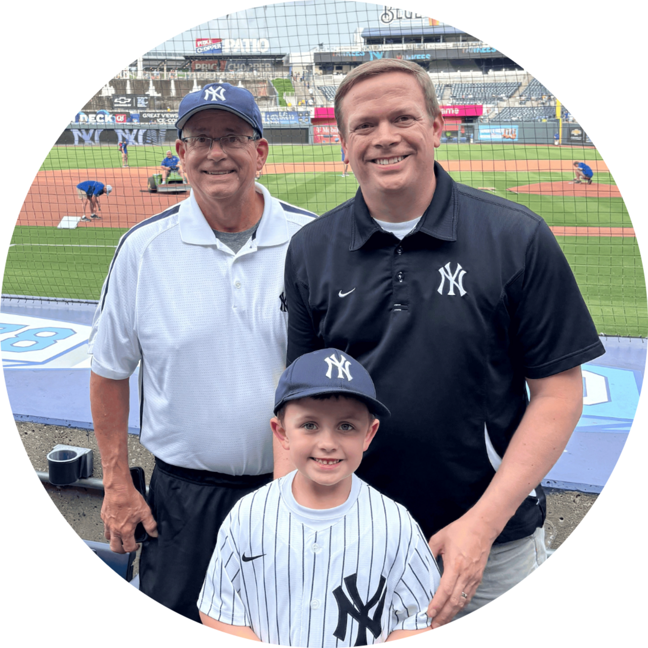 Jason, Chuck, and Harrison Brummond at a baseball game.