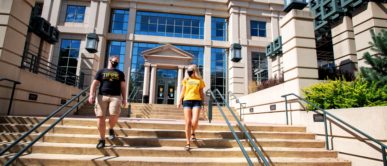 Students walking in front of the Pappajohn Business Building