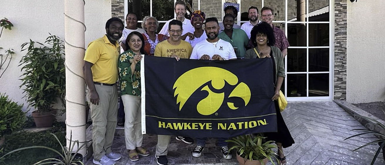 people standing with a tigerhawk flag