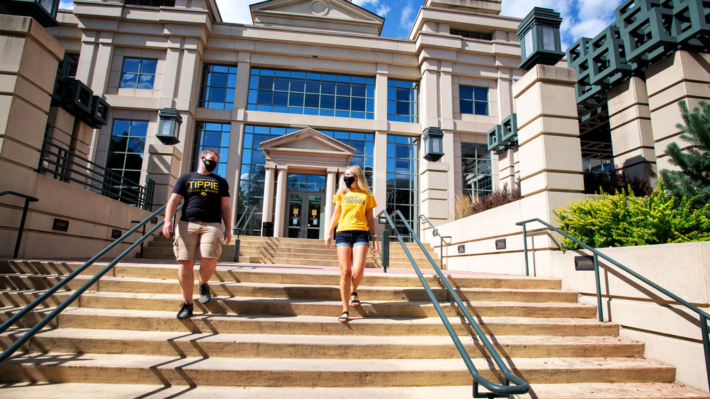 Students walking in front of the Pappajohn Business Building