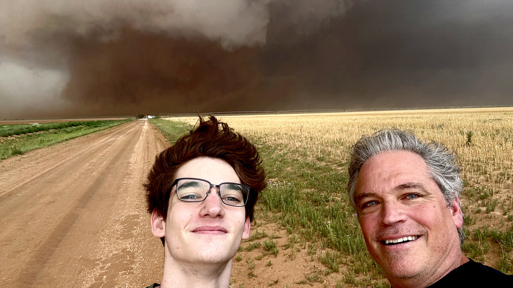 Stephen and Mike Cross selfie in front of a tornado.
